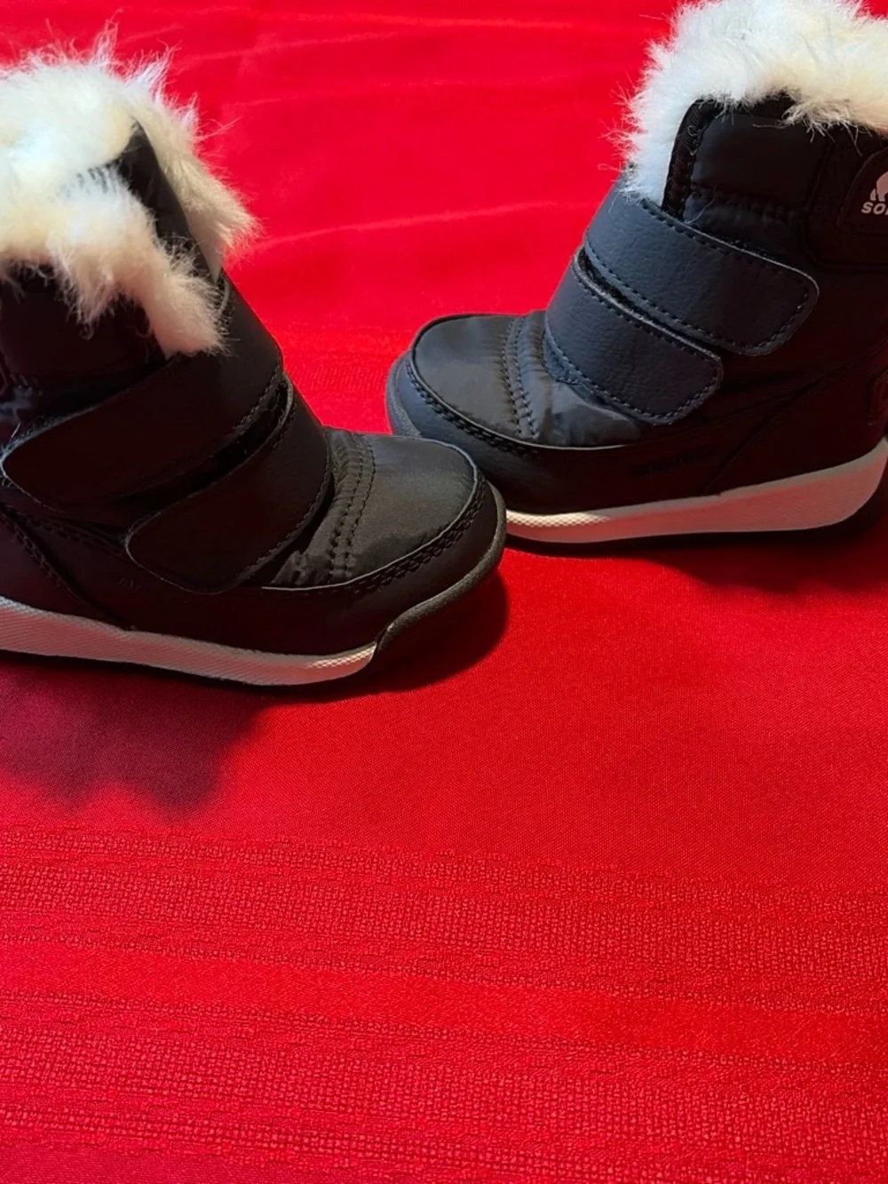 Sorel Black Kids Snow Boots with White Faux Fur Cuff
